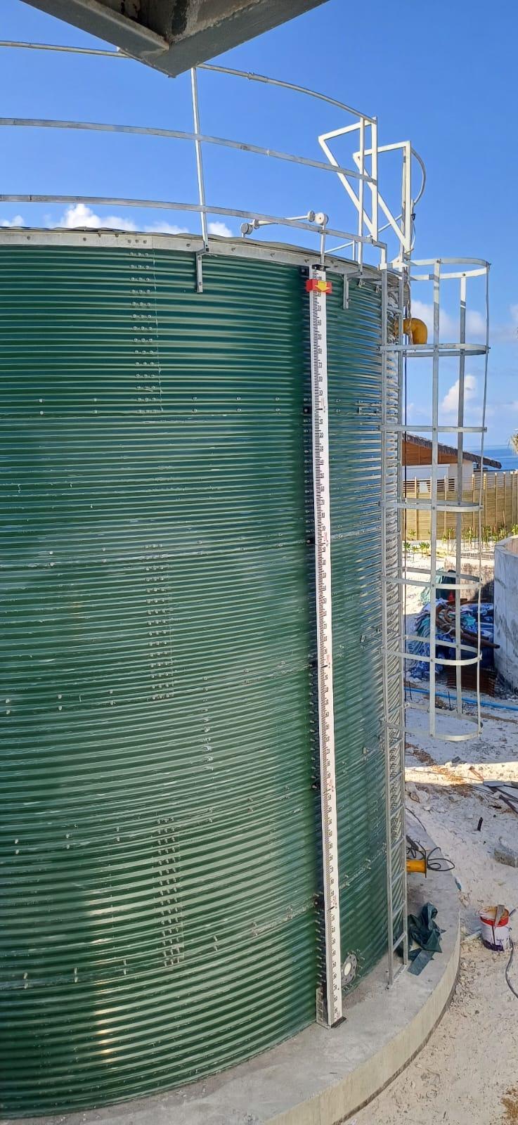 Water storage tank with access ladder and level gauge